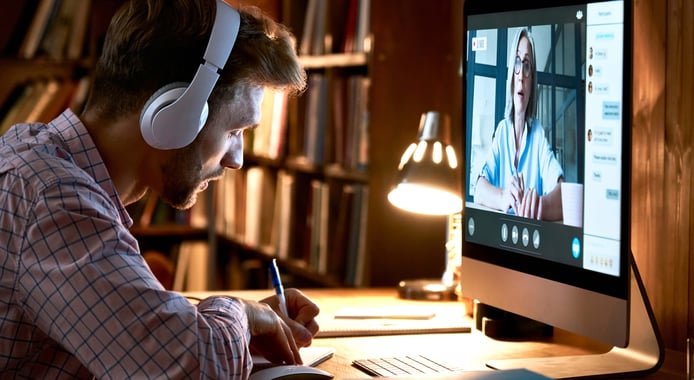 Man-on-online-conference-with-headphones