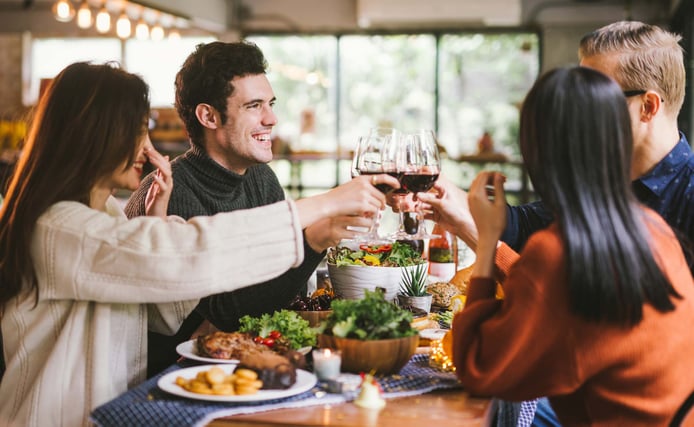 People-gathering-at-table-during-holidays