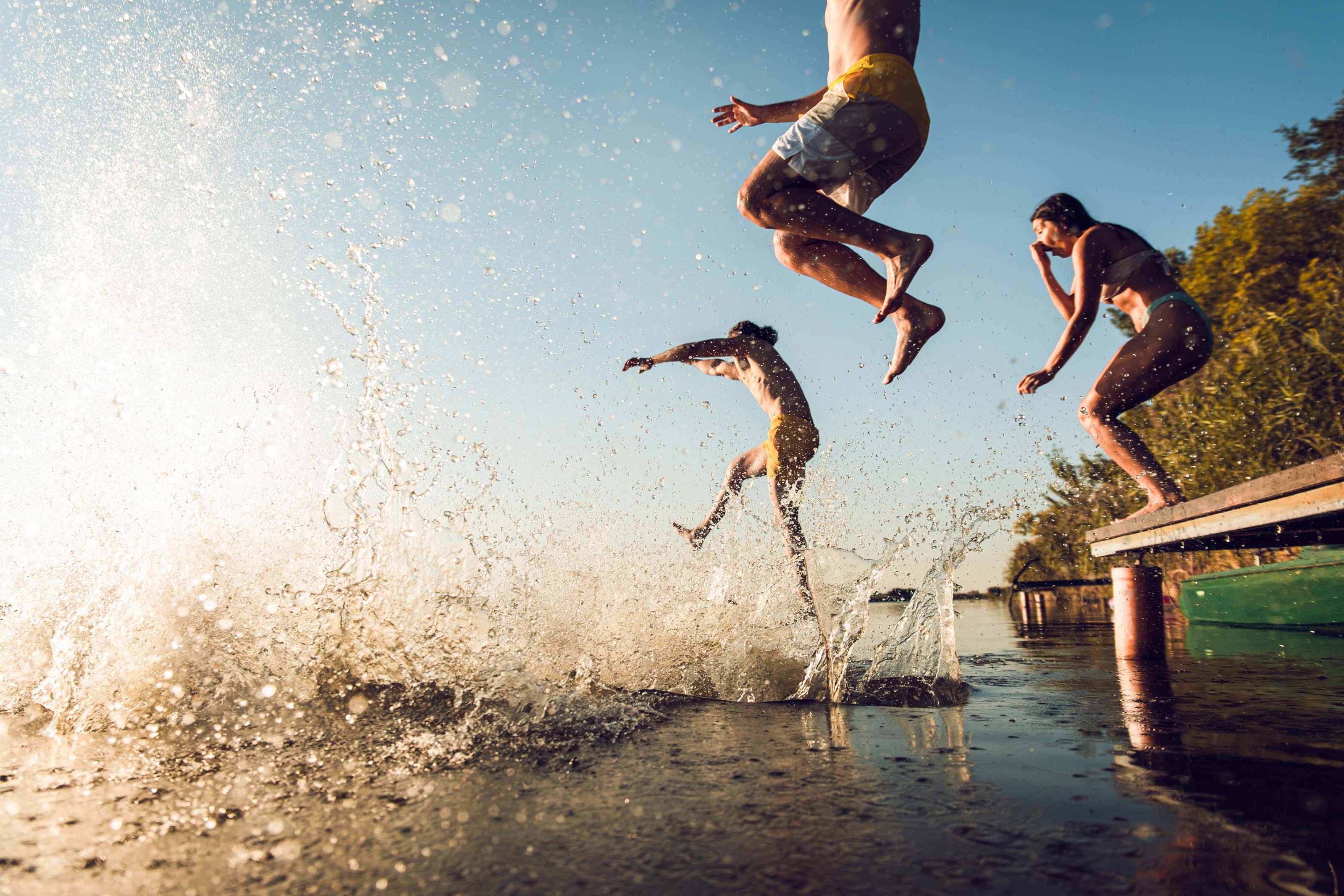 People-jumping-into-water